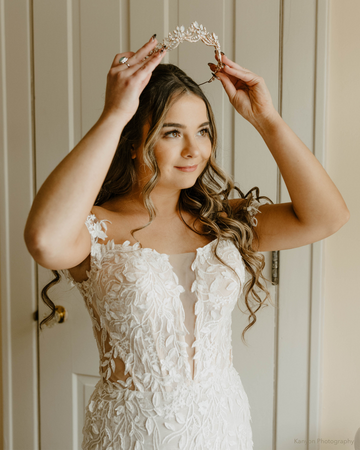 Bride in Wedding Dress Wearing a Tiara with Opals and Rhinestones on her Wedding Day