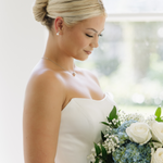 Bride wearing Dareth Colburn jewelry set with pearl studs and CZ accents