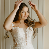 Bride in Wedding Dress Wearing a Tiara with Opals and Rhinestones on her Wedding Day