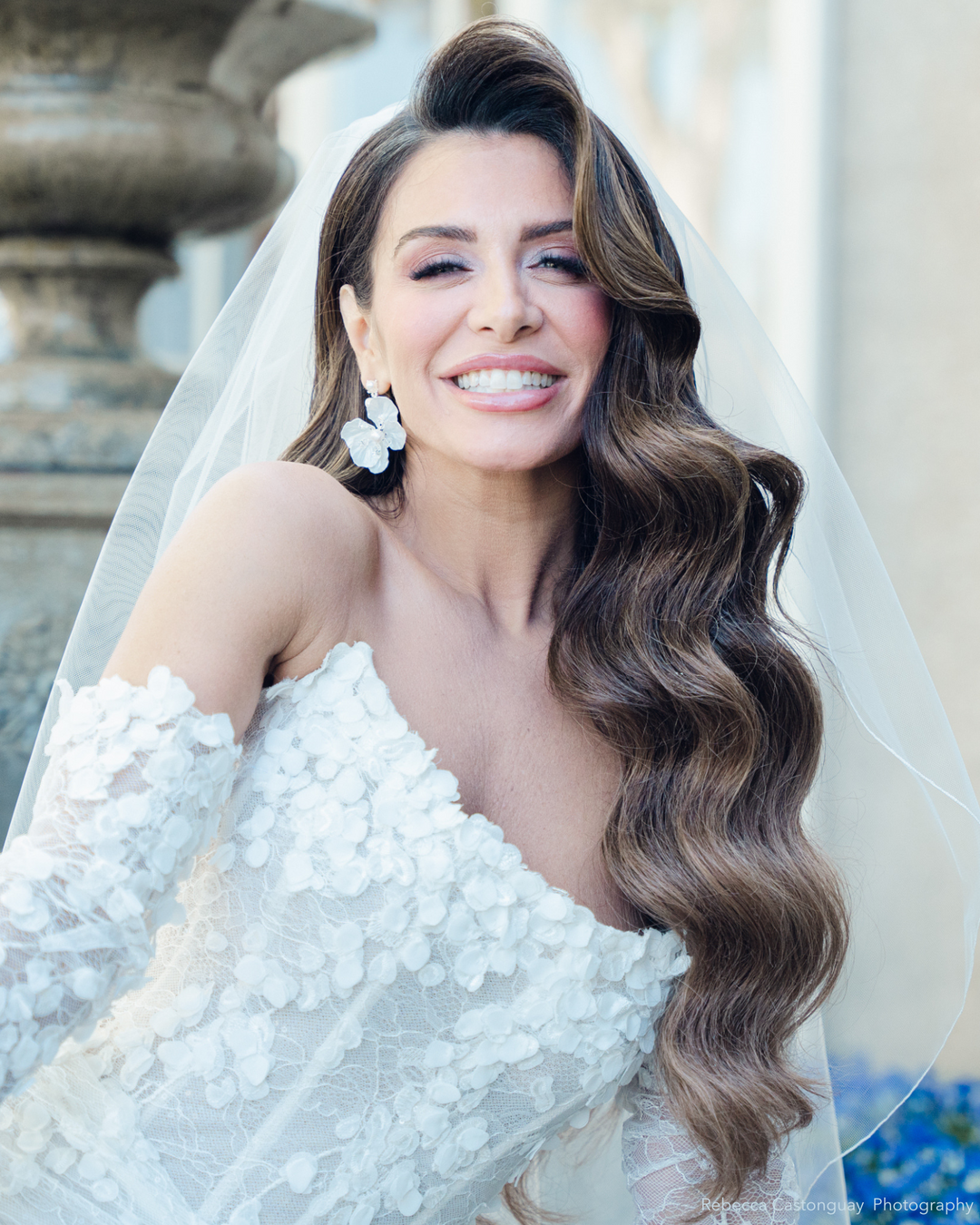 Bride wearing wedding veil with a pencil edge