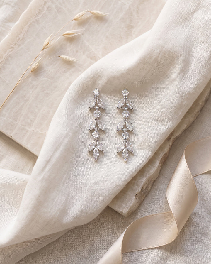 Full length of the Sydney earrings showing three stacked clusters of marquise cubic zirconia