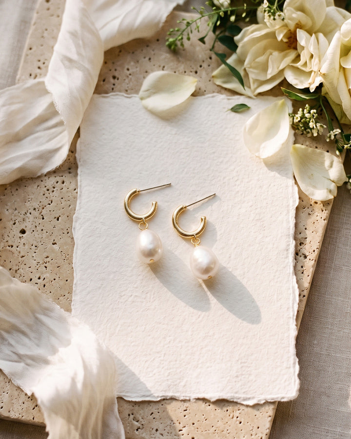 Gold Bali pearl hoops on handmade paper with ivory roses and silk ribbon