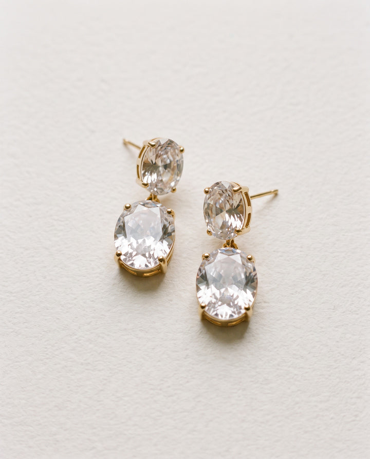 Rosina gold bridal earrings with two oval cubic zirconia stones in a double drop