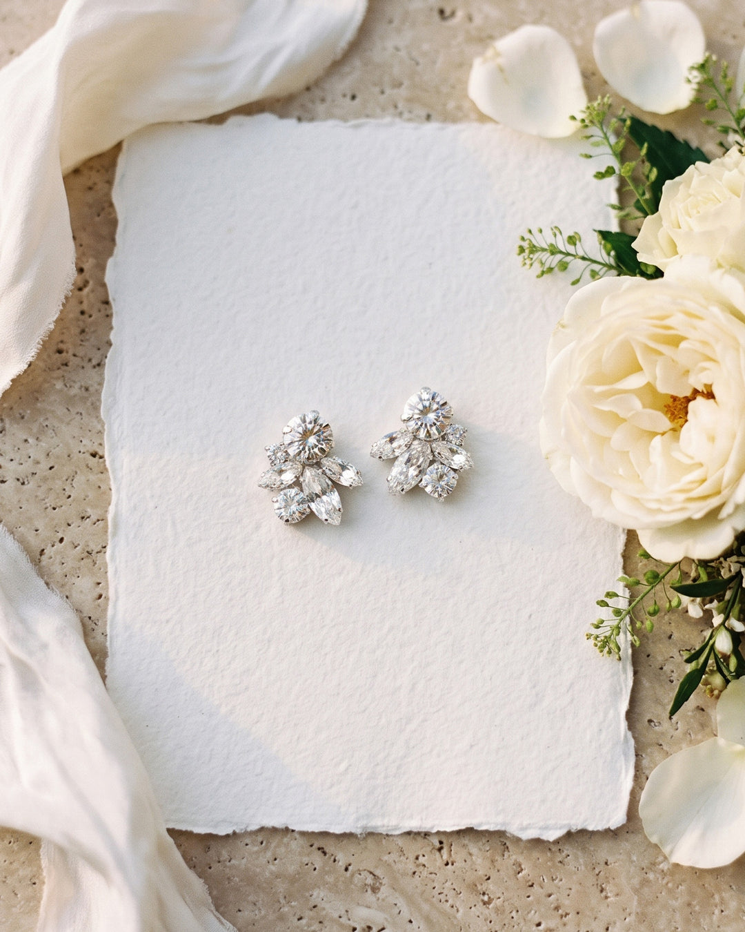 Janelle wedding studs on deckle paper with cream roses and petals