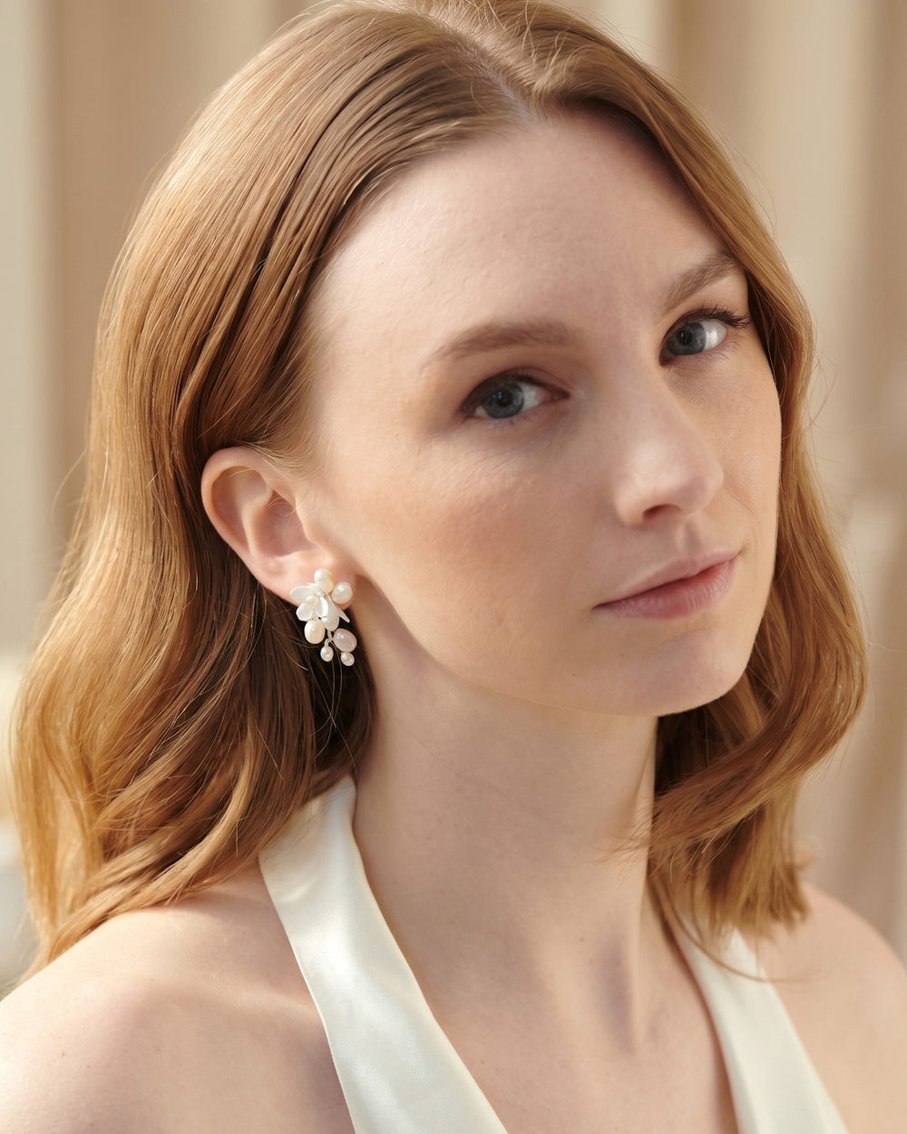 Taylor Petite pearl drop earrings in a styled shot with florals and hand-wired freshwater pearls