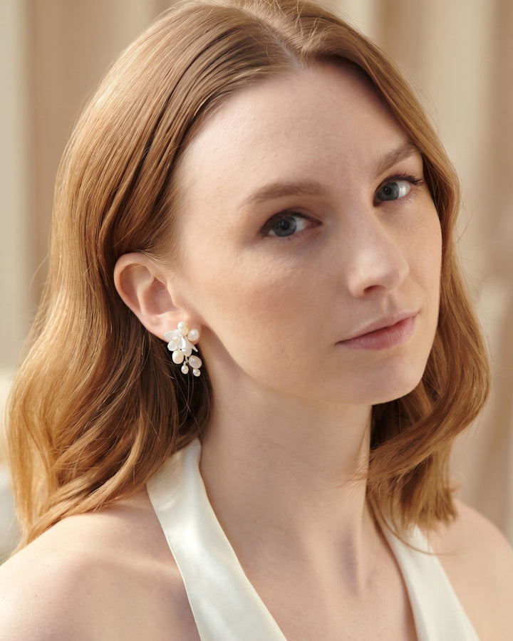 Taylor Petite pearl drop earrings in a styled shot with florals and hand-wired freshwater pearls