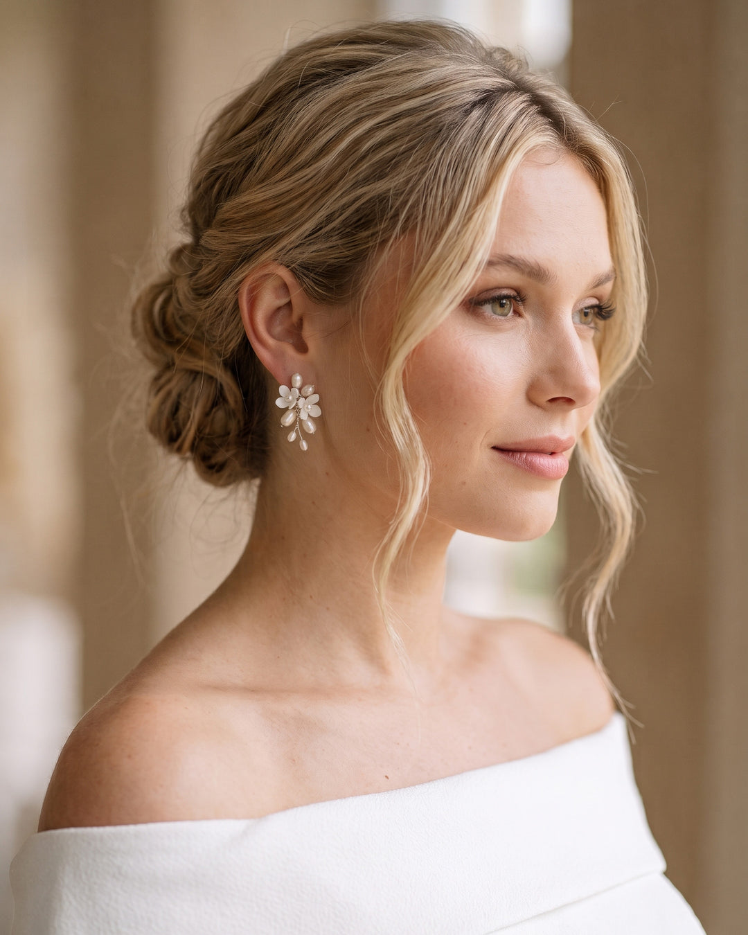 Styled view of the Taylor Petite wedding earrings showing the hand-wired freshwater pearls