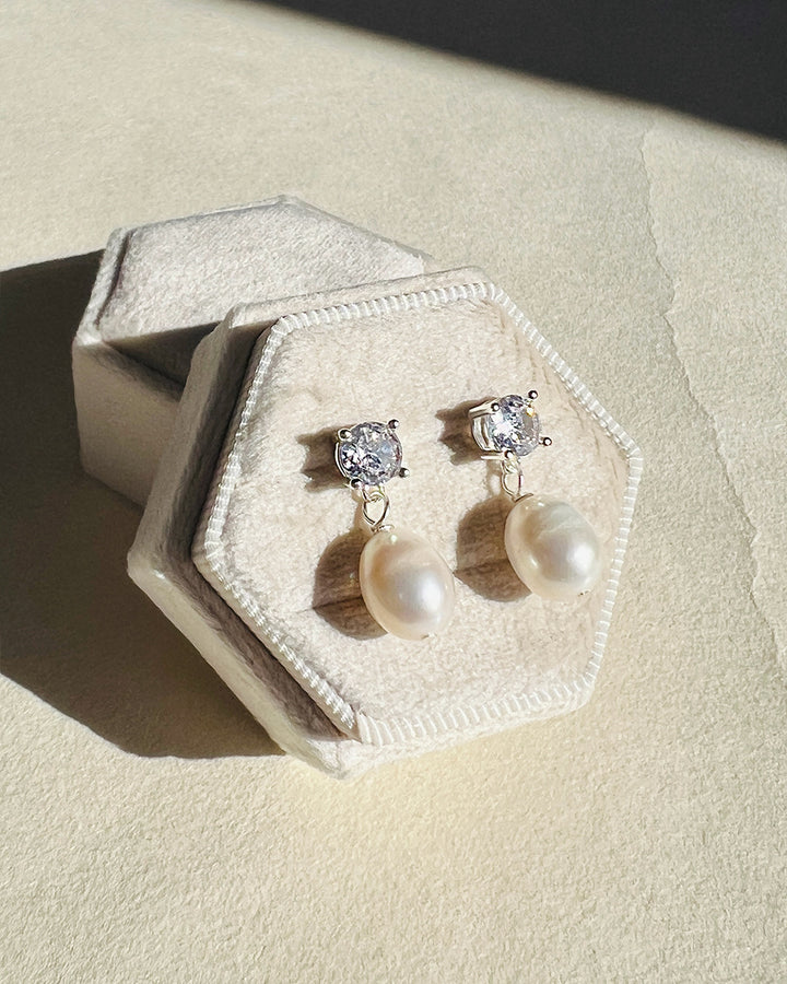 Silver pearl drop earrings with cubic zirconia studs