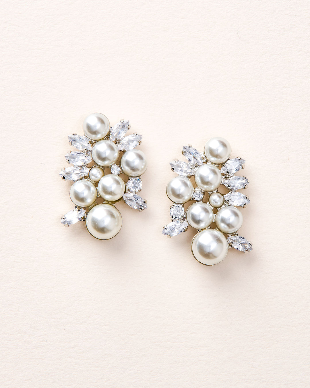 Annalise earrings with simulated diamonds and pearls in a clustered design, plated in 18k gold or rhodium