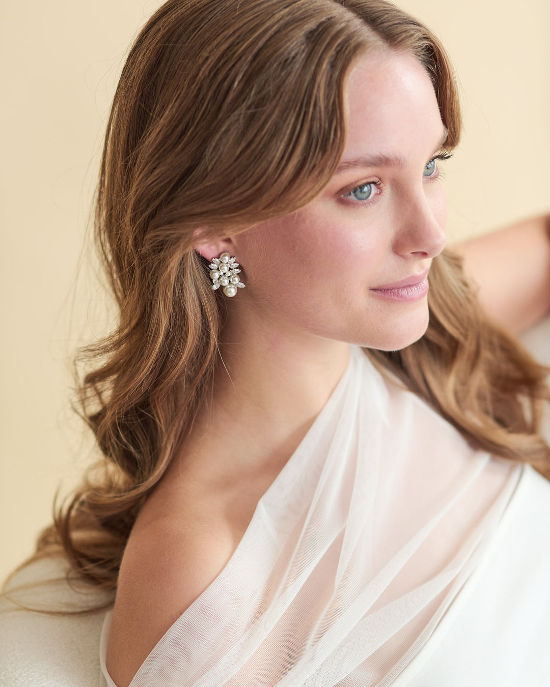 Annalise earrings with simulated diamonds and pearls in a clustered design, plated in 18k gold or rhodium