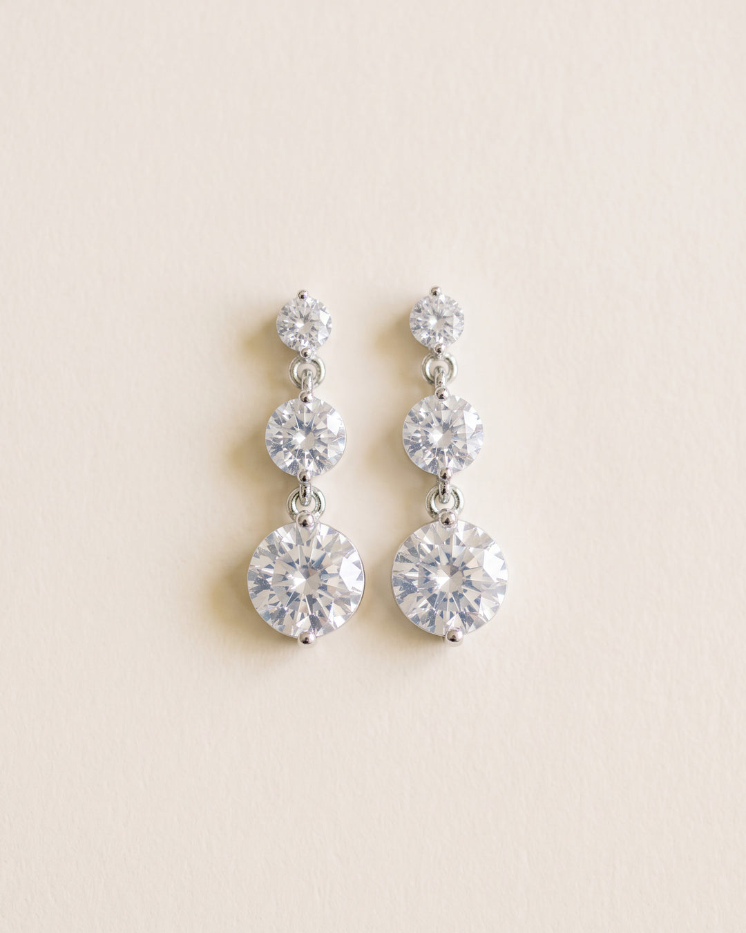 Nadia silver bridal earrings with three graduated cubic zirconia stones