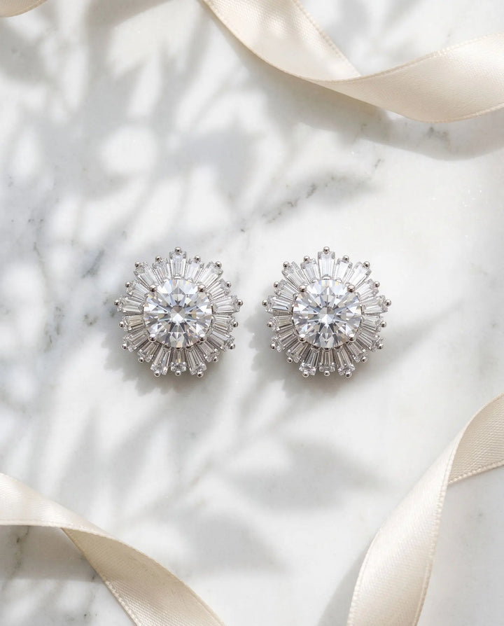 Close-up of Shivani CZ stud earrings showing the baguette halo and 0.5 inch silver setting