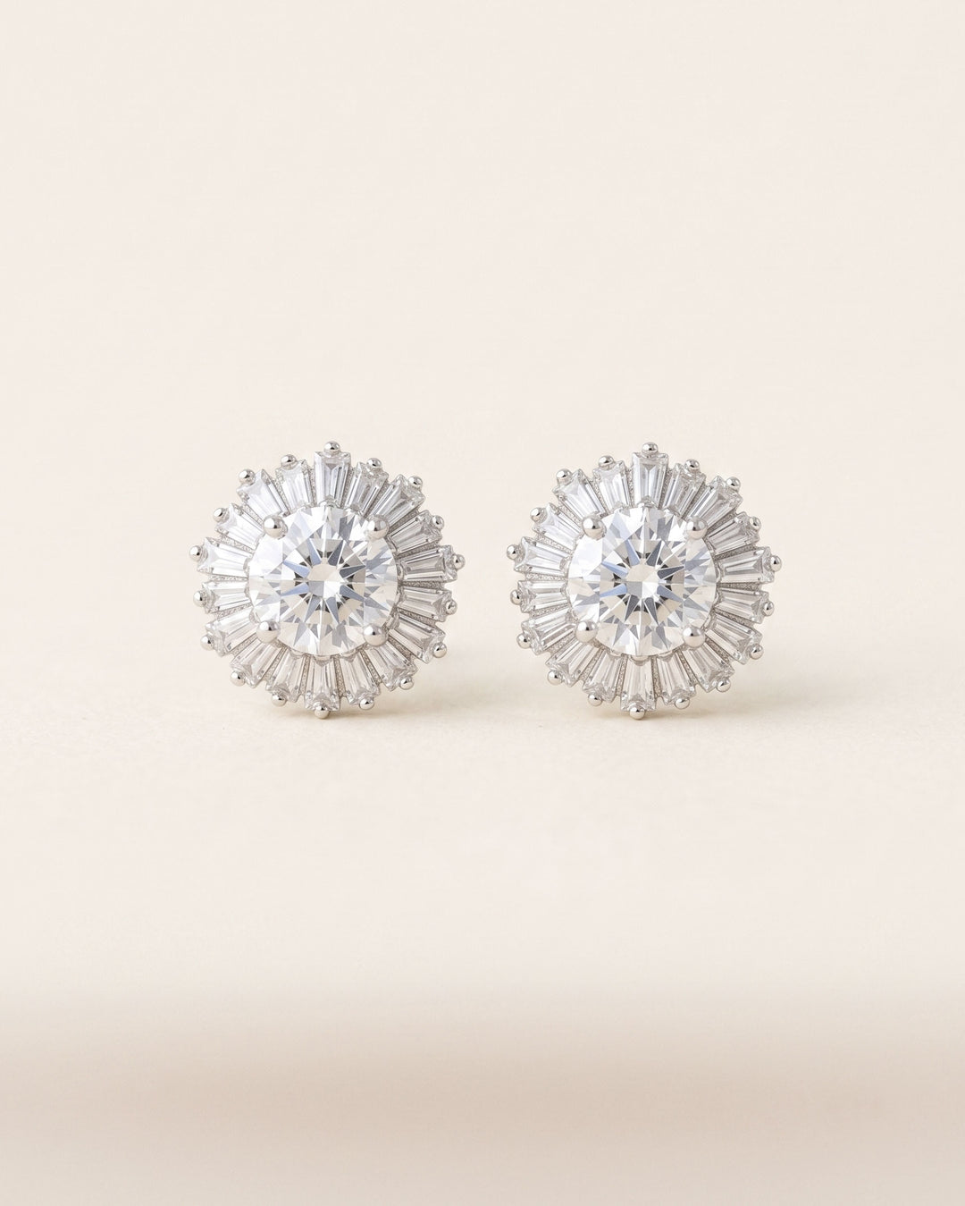 Shivani Studs — cubic zirconia sunburst stud earrings with baguette and round-cut stones in silver