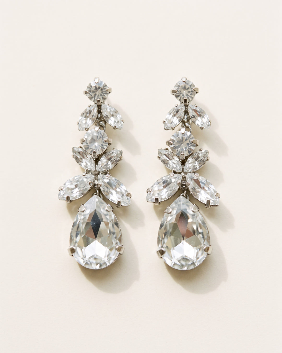 Tiana silver bridal earrings with a graduated cluster of marquise and teardrop-cut crystal