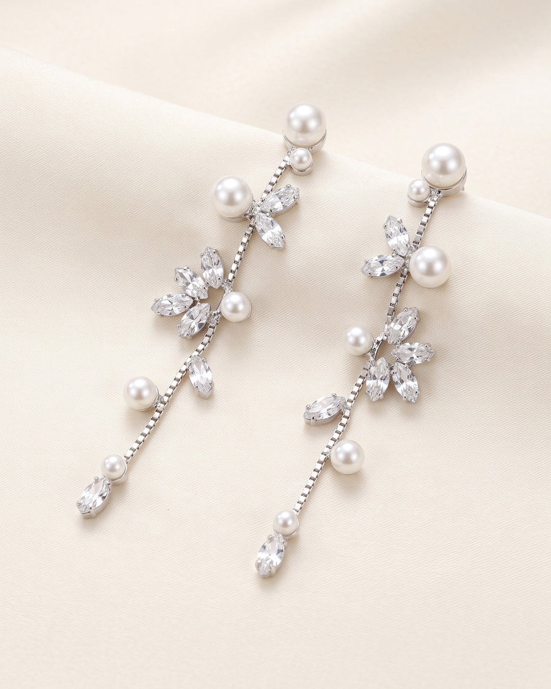 Katrina silver bridal earrings with a cascading line of marquise cubic zirconia and pearls
