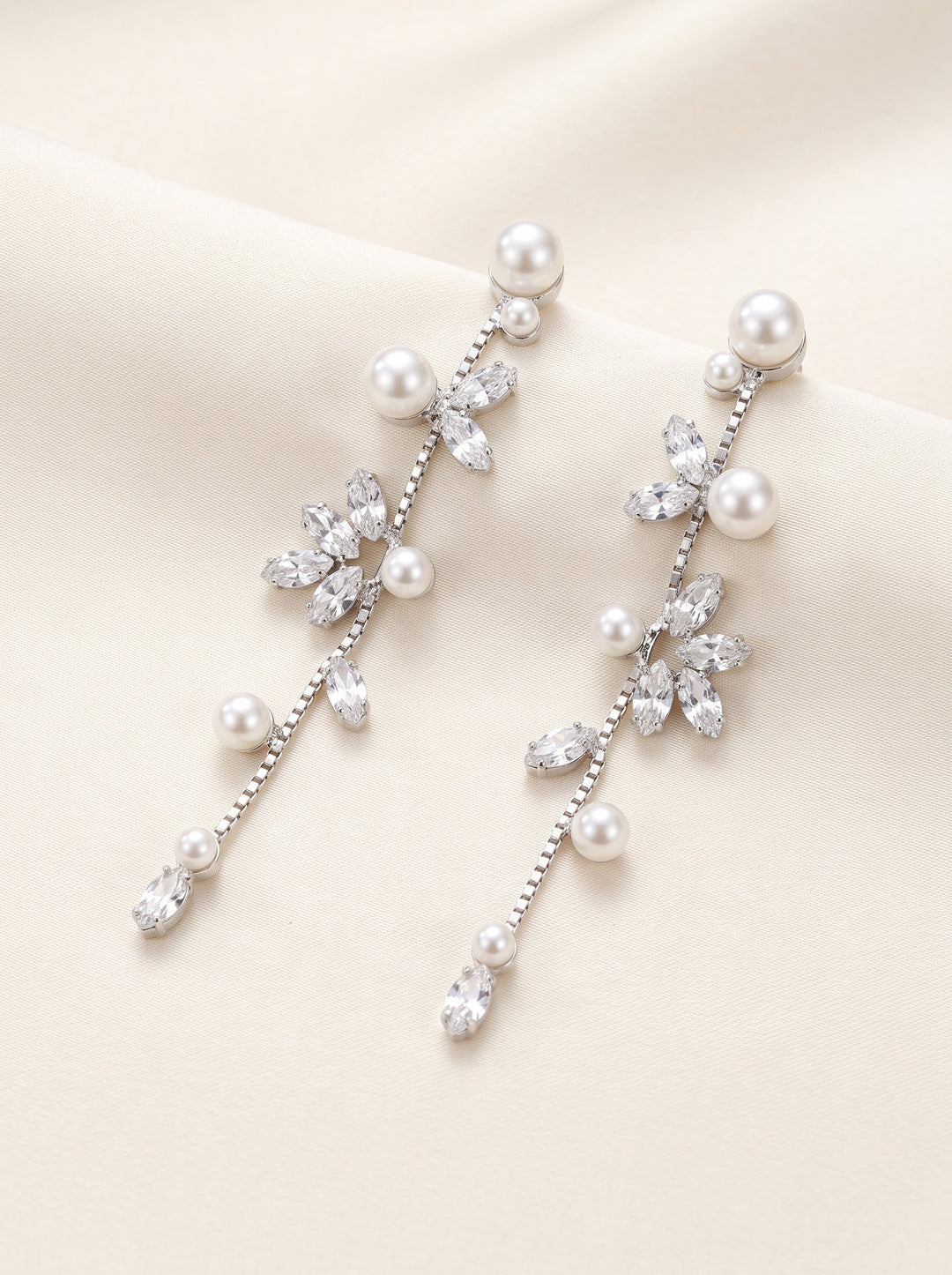 Katrina silver bridal earrings with a cascading line of marquise cubic zirconia and pearls