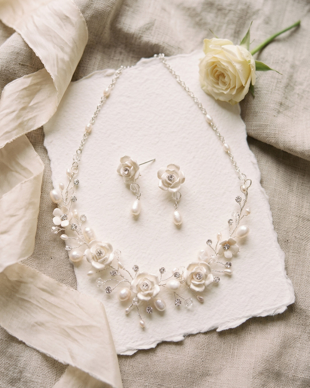 Rose Flower floral necklace and earrings on handmade paper with ivory ribbon and a white rose