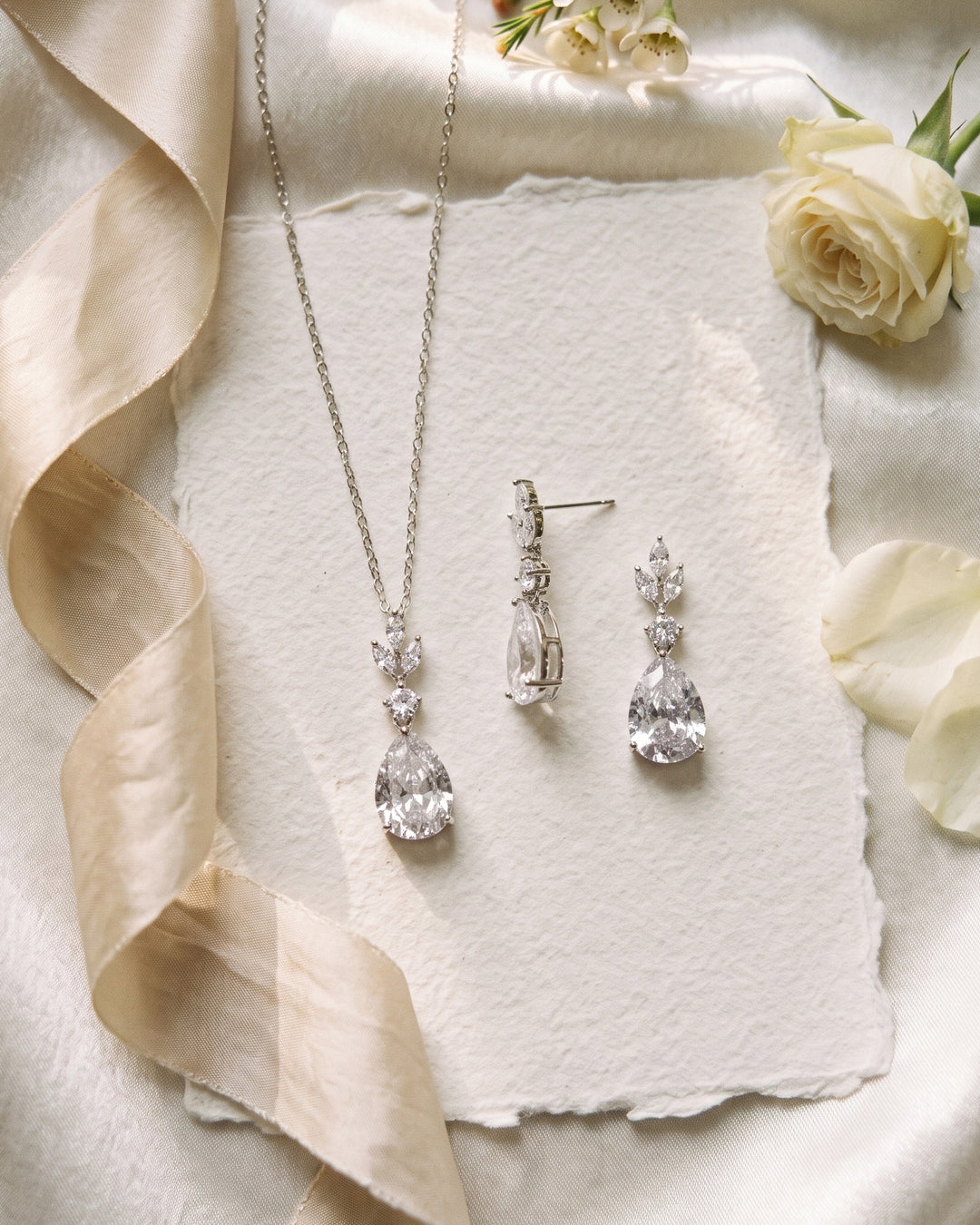 Candice teardrop pendant and earrings on handmade paper with silk ribbon and ivory roses