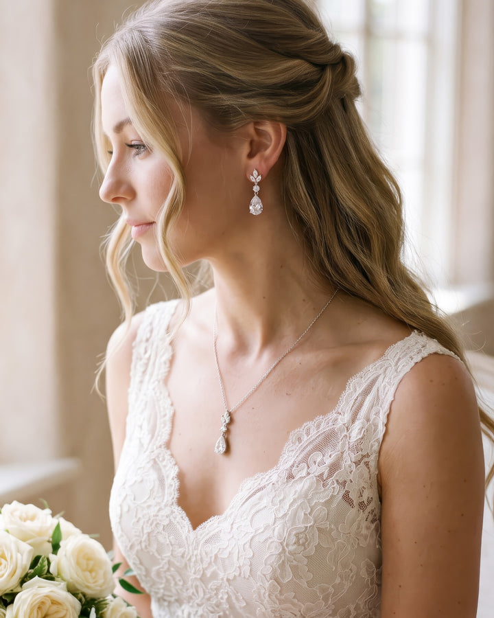 Bride in a lace gown wearing the Candice teardrop pendant and drop earrings