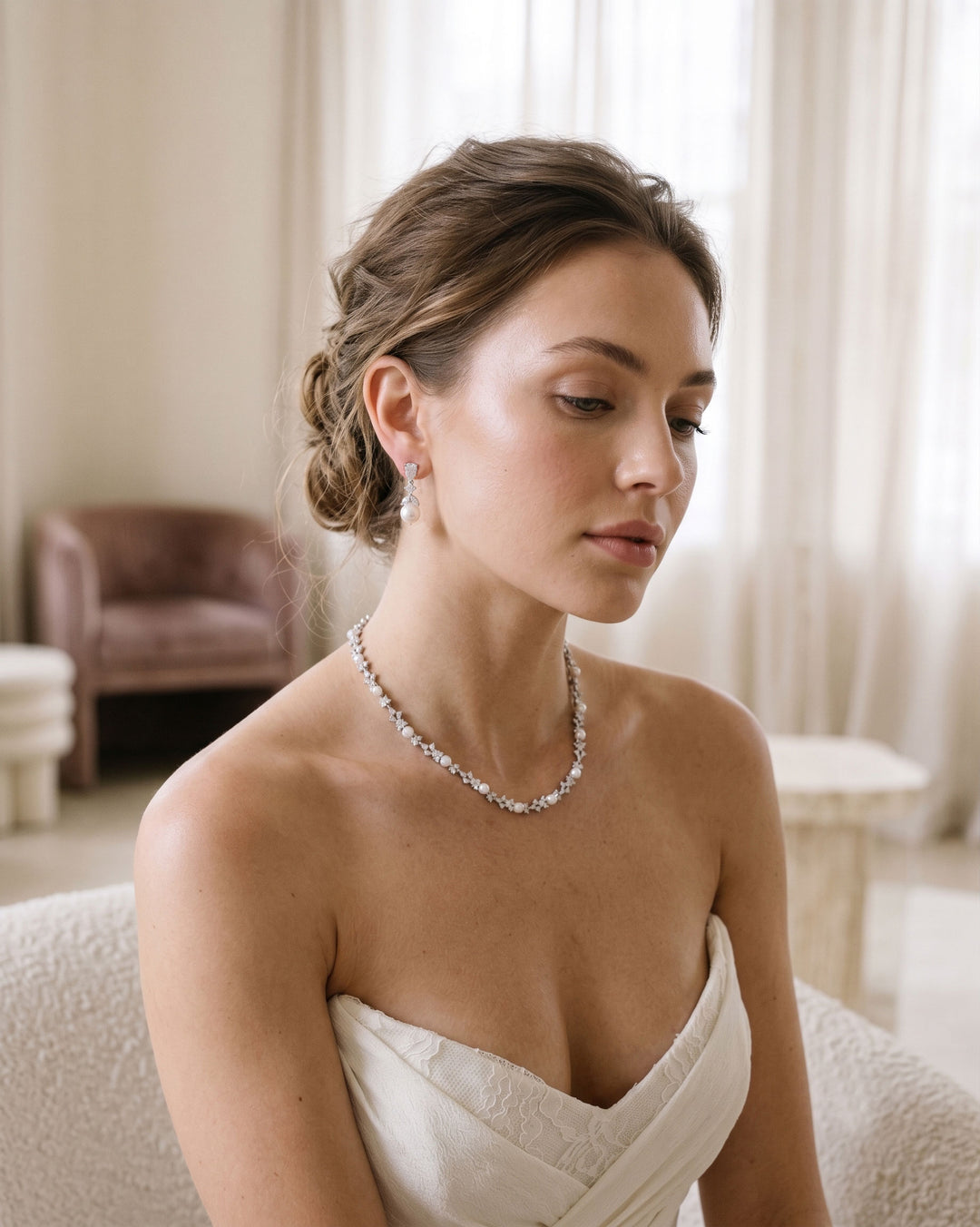 Bride wearing pearl jewelry necklace and earrings