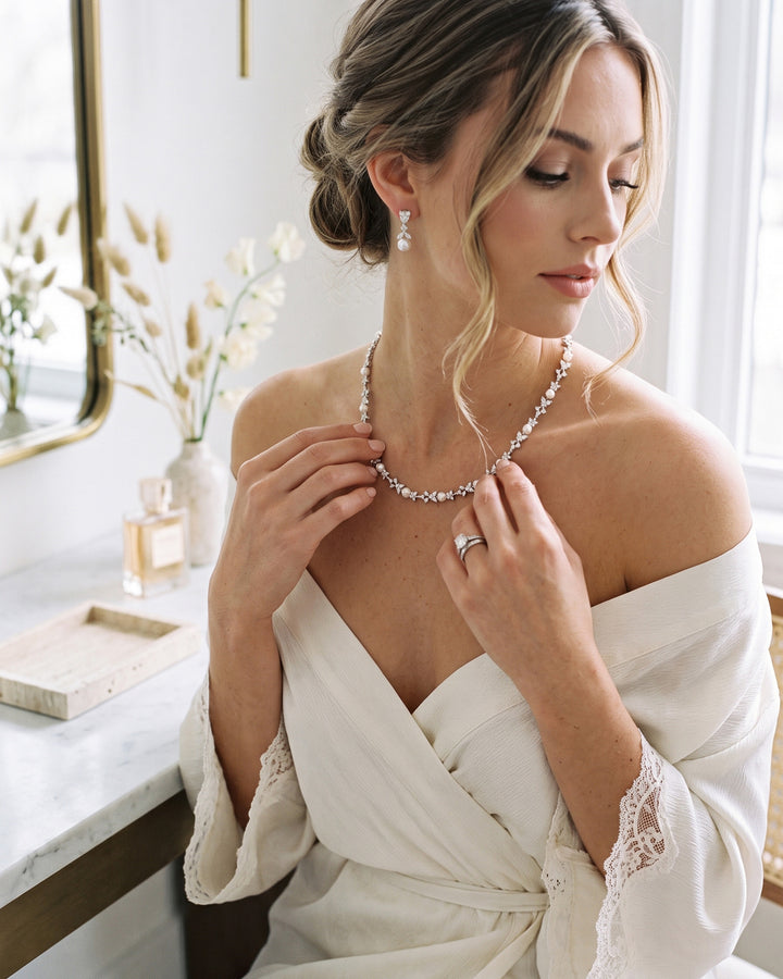 Bride at her vanity wearing the Kelsey pearl necklace and drop earrings