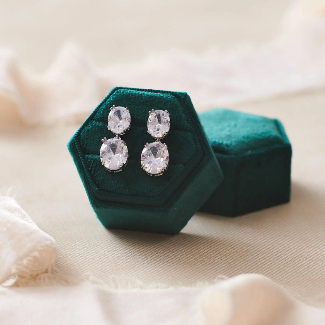 CZ wedding earrings in emerald green ring box 