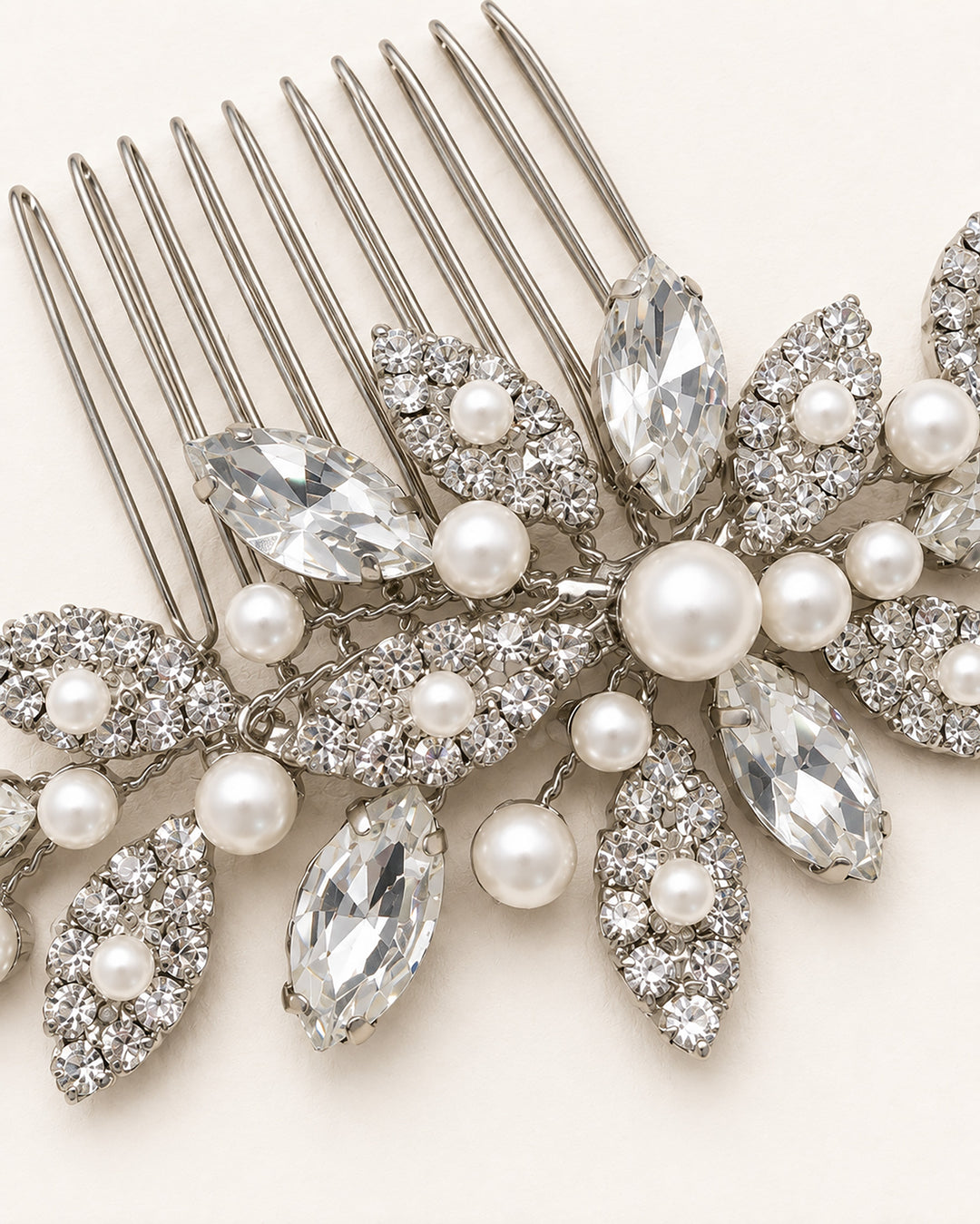 Silver bridal hair comb with marquise rhinestone leaves and round pearls of varying sizes