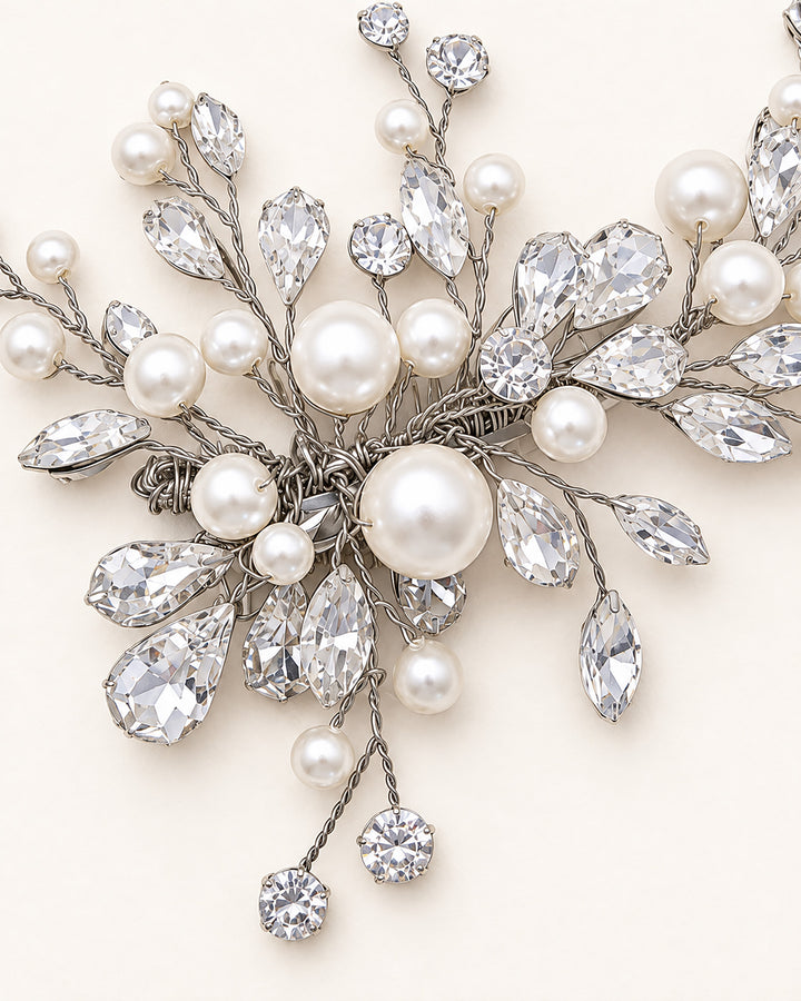 Close-up of a wedding hair clip with pearl and rhinestone tipped branches