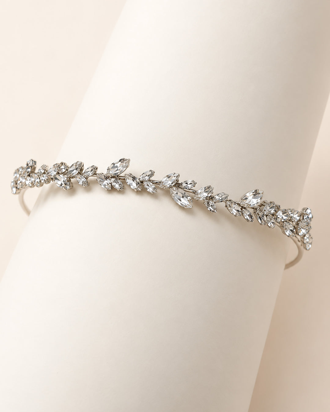Full length of the Priya rhinestone headband, a slim vine of marquise leaves