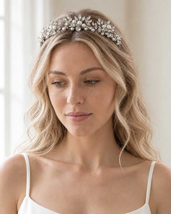Amalie silver bridal tiara with rhinestone leaves and ivory pearls worn with soft loose wedding waves