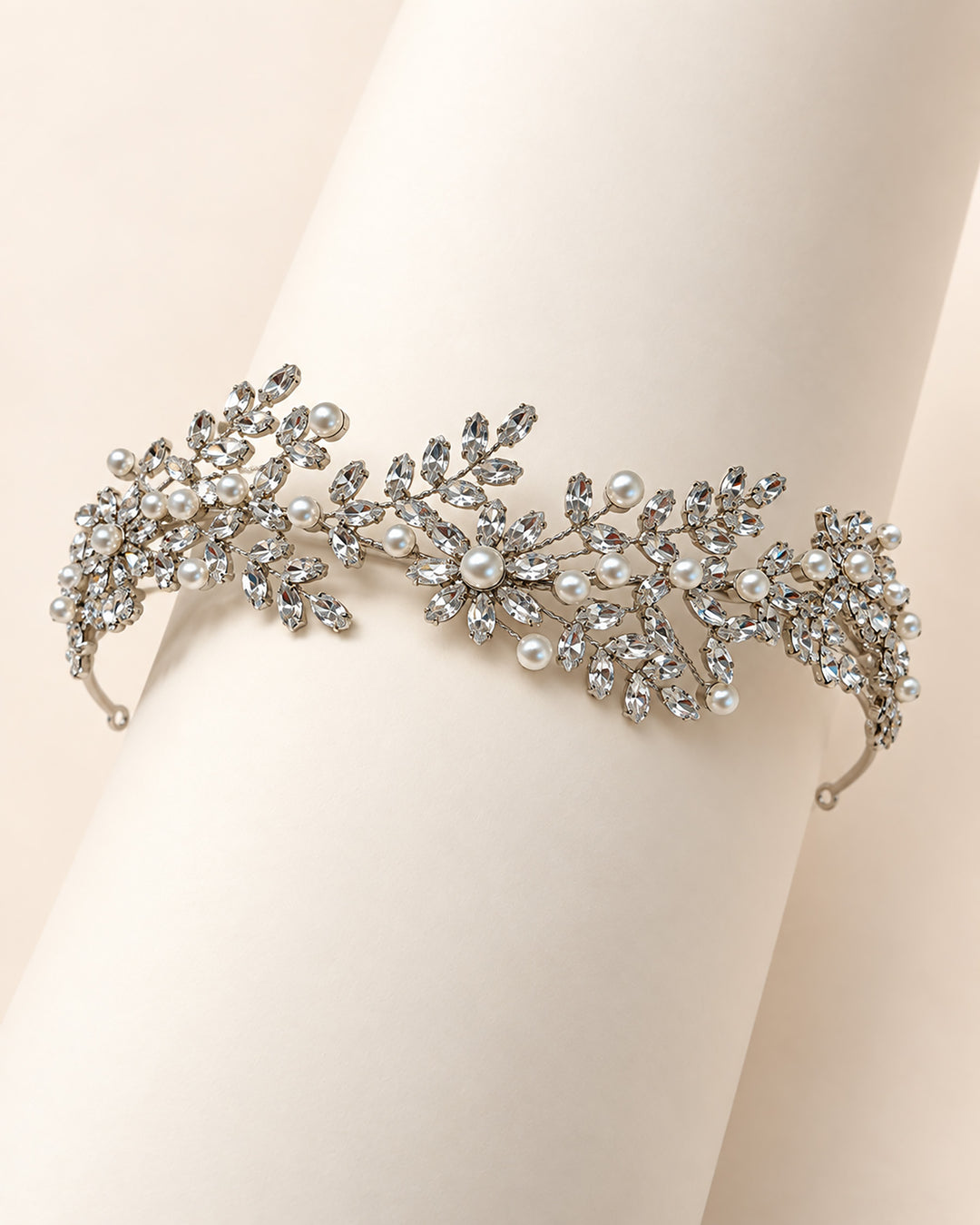 Full length of the Liora headband showing rhinestone leaf and blossom clusters with ivory pearls