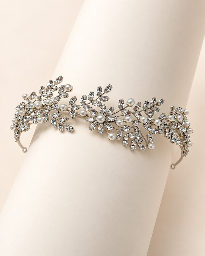 Full length of the Liora headband showing rhinestone leaf and blossom clusters with ivory pearls