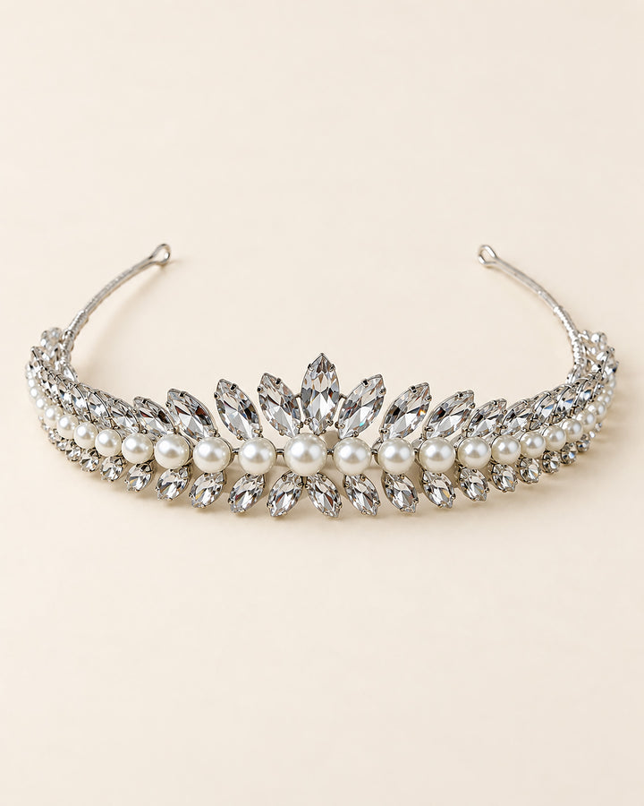 Full view of the Mavis wedding tiara, with a rhinestone and pearl center peak tapering to pin-loop ends