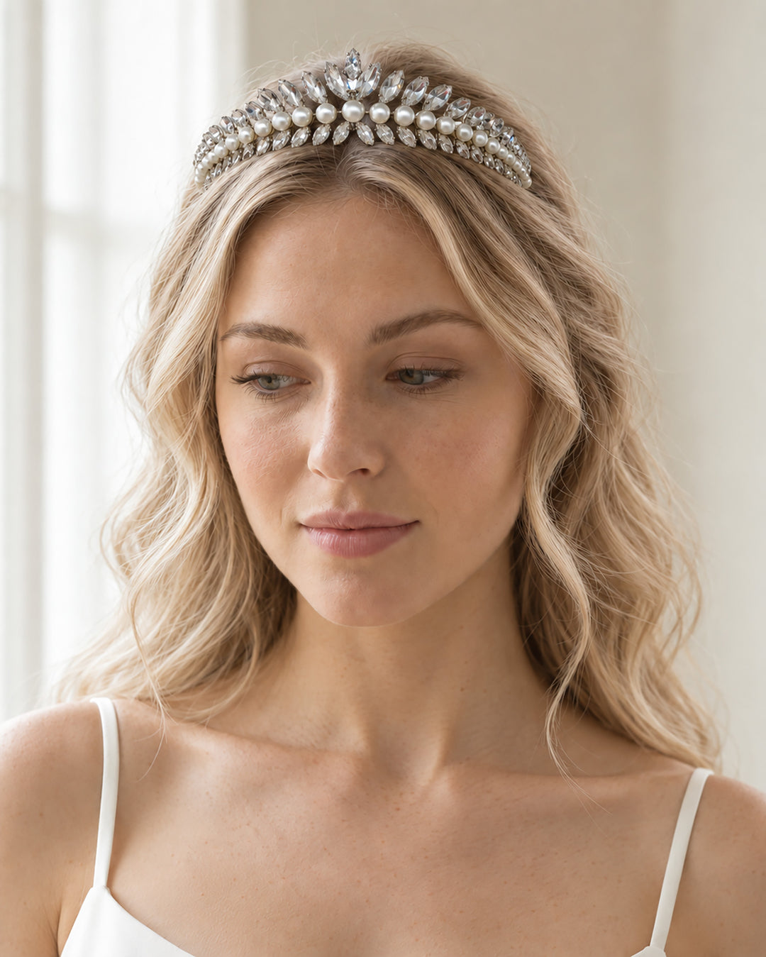 Mavis modern silver bridal tiara with marquise rhinestones and ivory pearls worn with soft loose waves