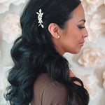 Freshwater pearl and gold flower hair pin in bride's wedding hairstyle