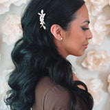 Freshwater pearl and gold flower hair pin in bride's wedding hairstyle