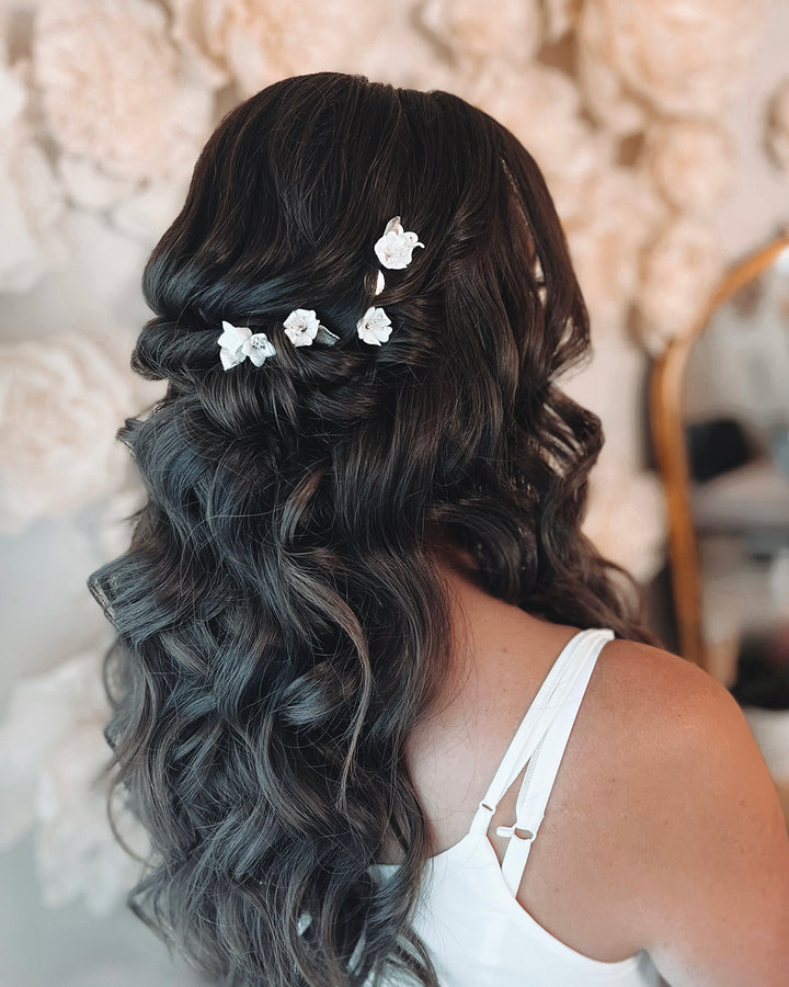 Ivory flower wedding hair pins in half up and down bridal hairstyle