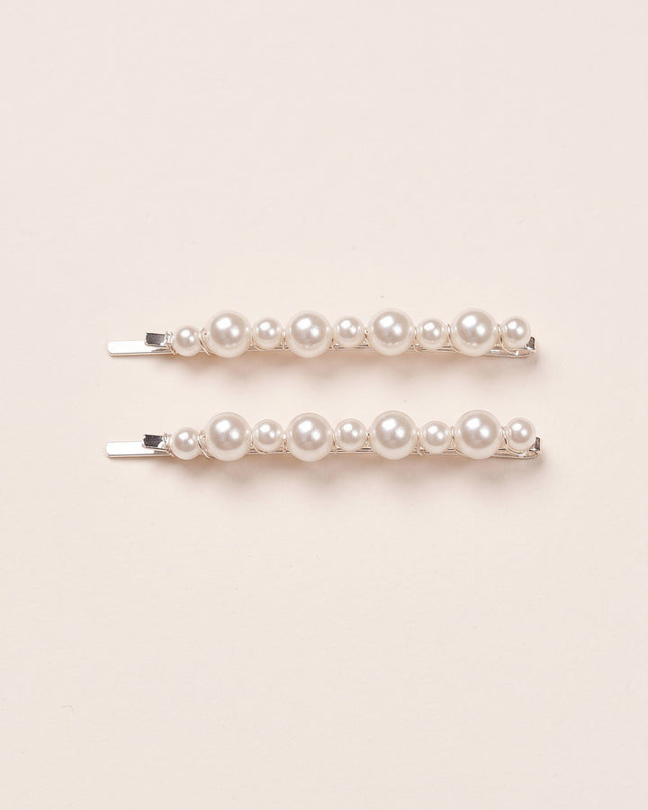 Set of two pearl bobby pins with alternating small and medium off-white pearls