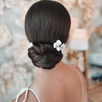 Bride wearing Dareth Colburn Hair Pins that are ivory clay flowers with beads
