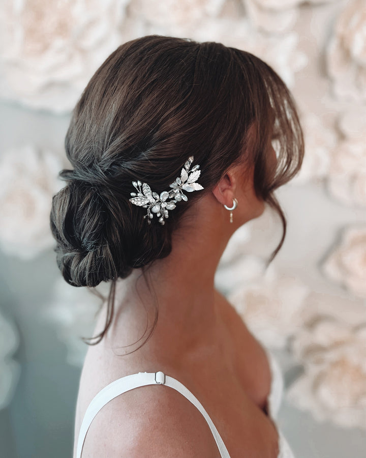 Silver wedding hair pin in bridal updo hairstyle