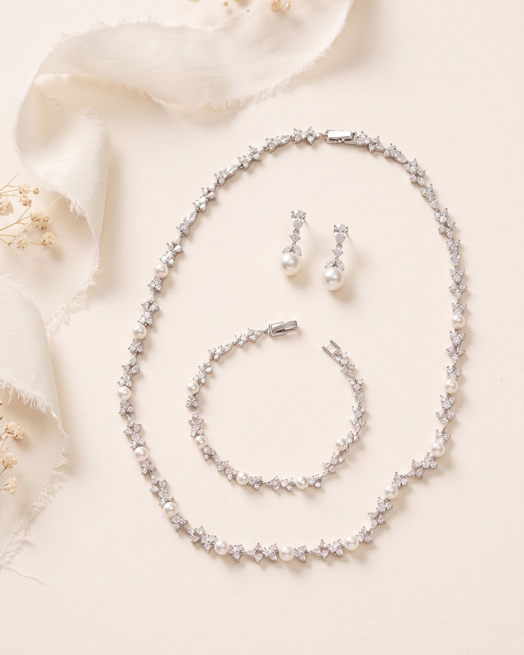 Kelsey Necklace, Earrings and Bracelet Set in silver, a matching bridal pearl and cubic zirconia jewelry set