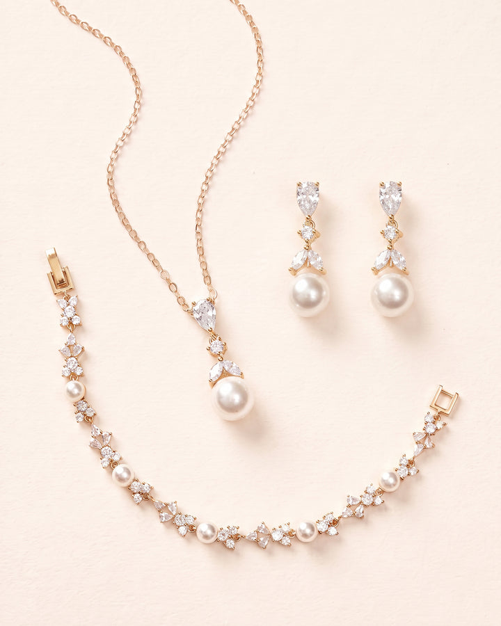 Gold Kelsey pearl pendant necklace, drop earrings and matching bracelet, a coordinated wedding jewelry set