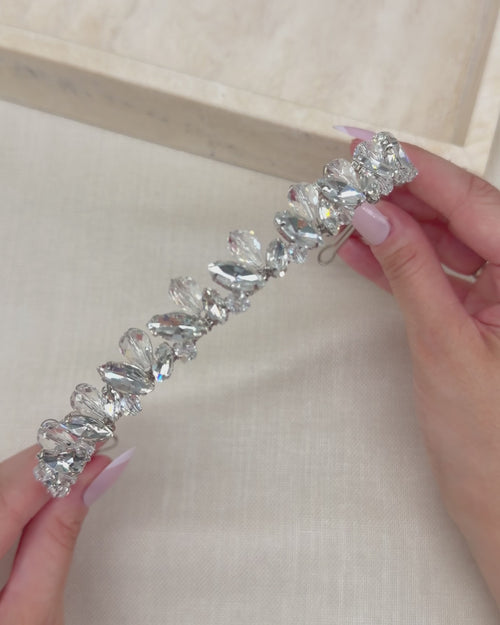 Video of a slim hand-wired silver bridal headband with marquise rhinestones and faceted crystal teardrops