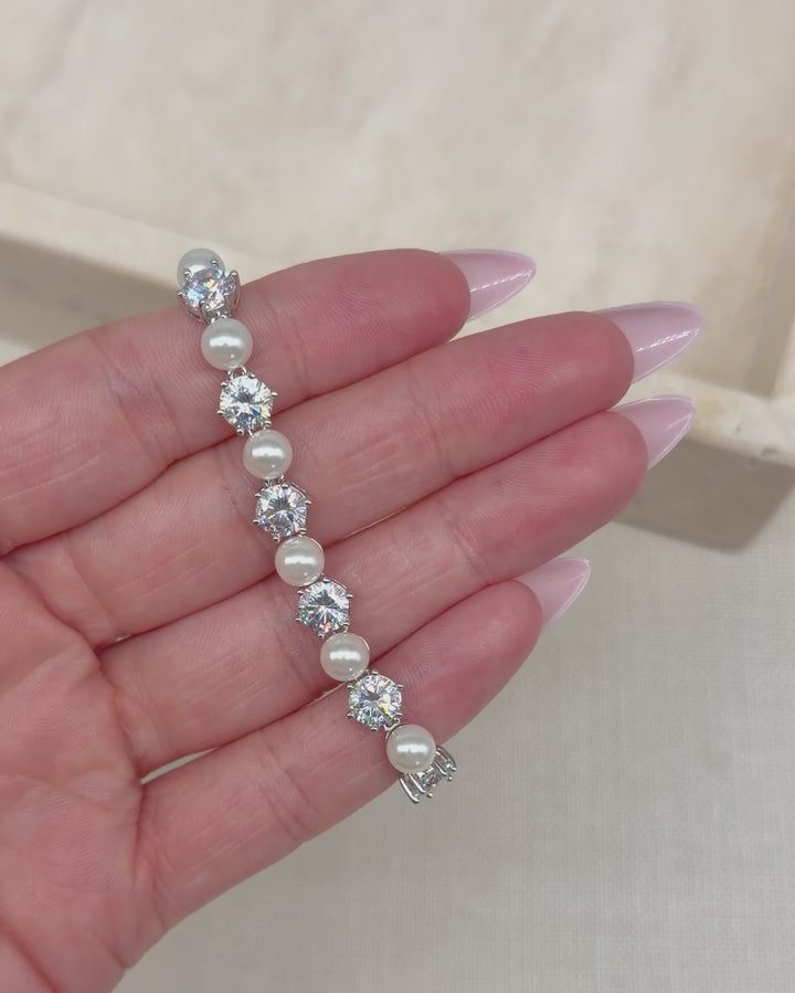 Pearl and CZ bracelet catching the light as it turns