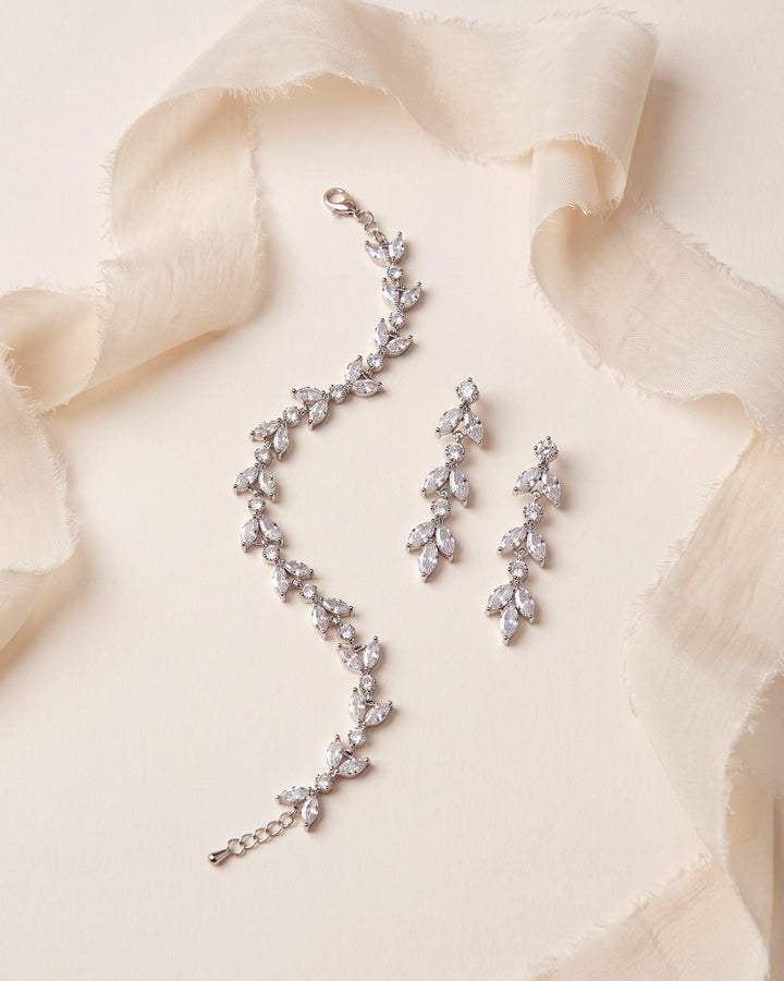 Sydney Earrings and Bracelet Set in silver, a matching floral bridal jewelry set in cubic zirconia