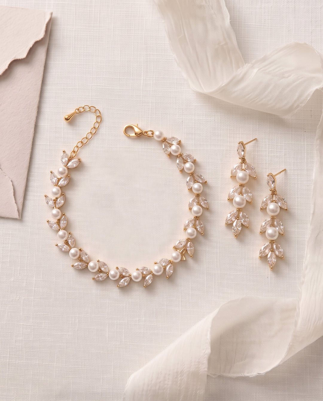 Gold Sydney Pearl wedding earrings and bracelet set with pearls and marquise cubic zirconia leaves